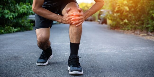 Knee Pain Man caught his knee due to pain